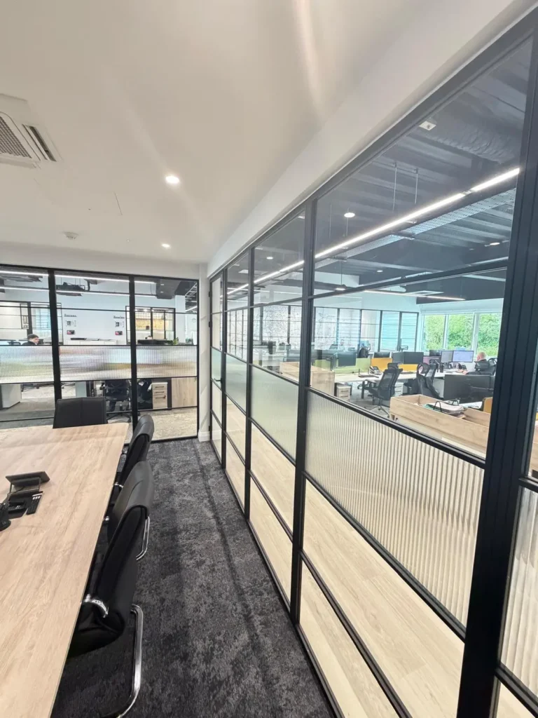 black premium frames steel office partition wall with privacy film running along open plan workspace UK